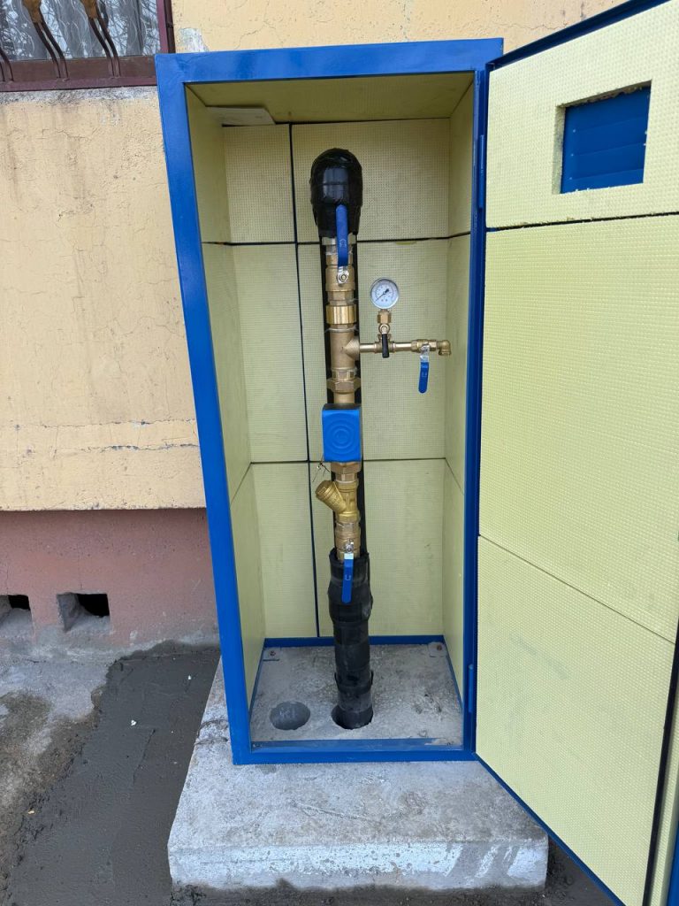 DN40 water meter assembly in front of Multi Family Building in Manavyiat Mahalla