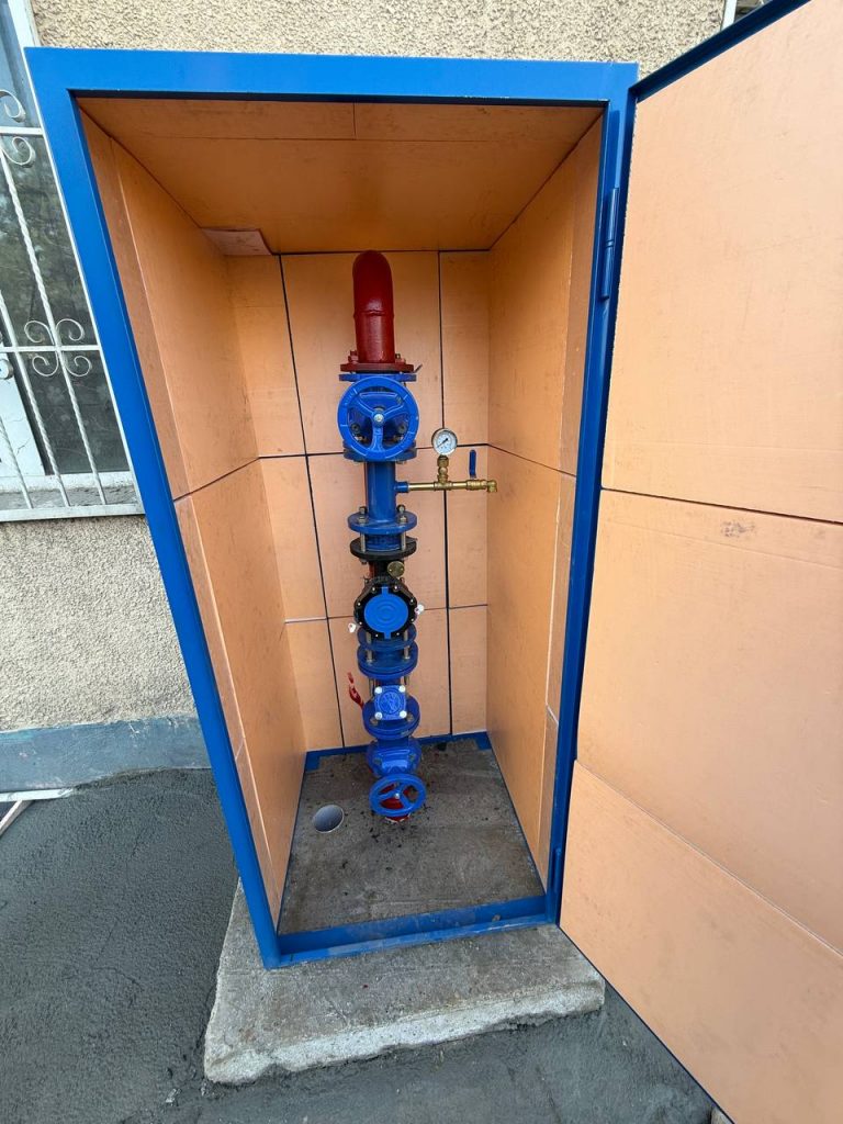 DN65 water meter Assembly in front of Multi Family Building in Furkat Mahalla