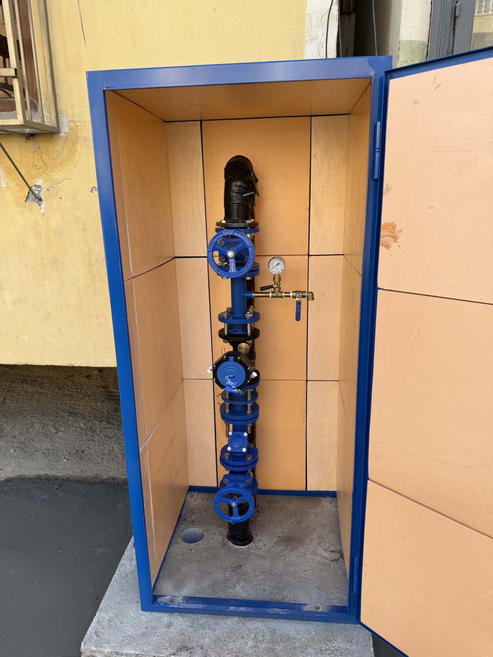 DN50 water meter Assembly in front of Multi Family Building in Oromgokh Mahalla